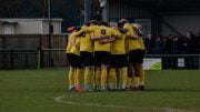 Hucknall Town FC players in a pre-match huddle