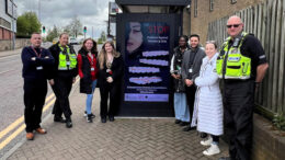 Students from Vision West Nottinghamshire College and members of Ashfield’s Safer Streets team with one of the posters designed to raise awareness of violence against women and girls