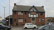 The old Shakespeare Inn boarded up and in a dilapidated condition