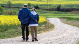 A couple walking in the countryside, arm in arm