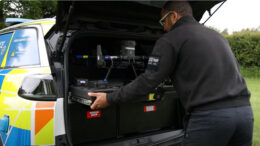 Police Sgt Vince Saunders removes a fully assembled drone from the rear of a dedicated specially designed car.