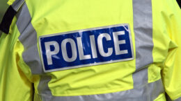 A close up of a police high vis yellow coat used as generic photo