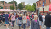 A crowd of shoppers in a marketplace in Hucknall