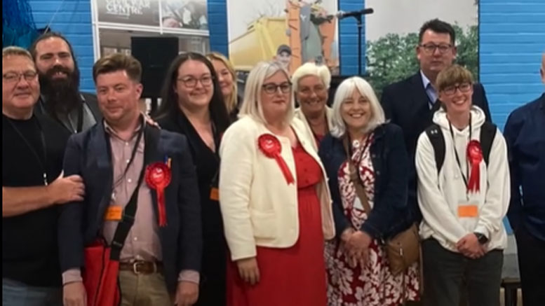 Michelle Welsh standing with a grouyp of Labour supporters